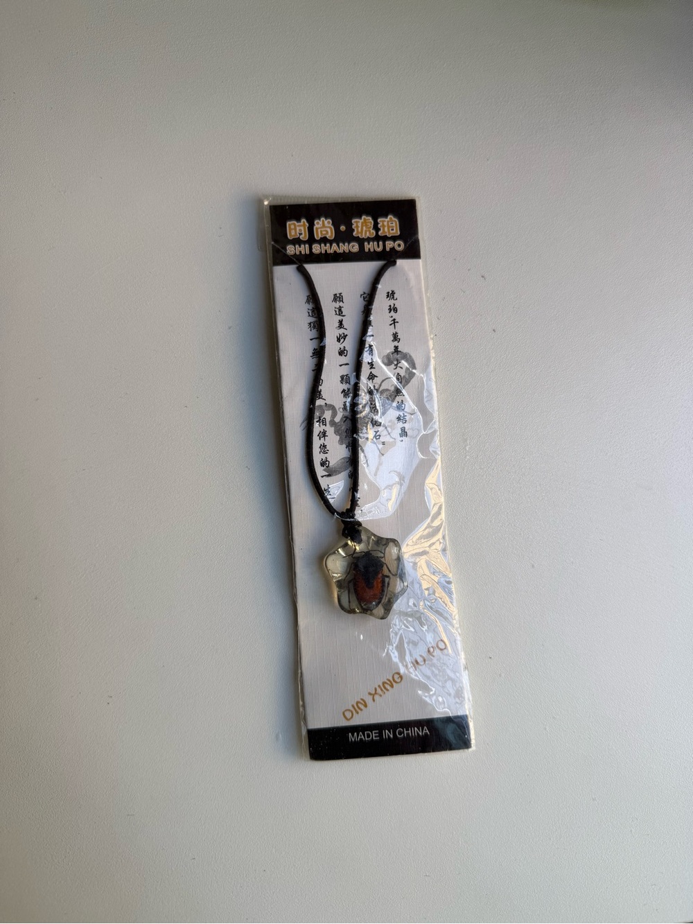 Black Cord Pendant Necklace with Amber-Tone Accent